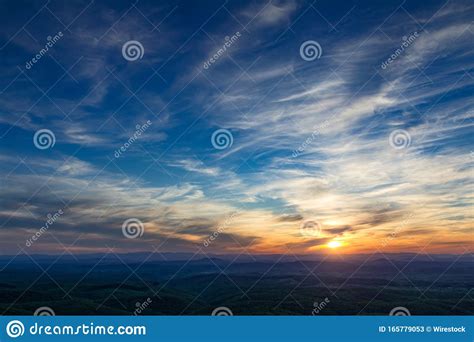 Breathtaking Sunset Scenery With The Golden Sun In The Cloudy Sky