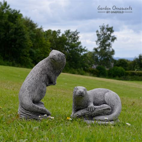 Lawn ornaments are decorative objects placed in the grassy area of a property. Otter Pair Garden Ornament Statue - Garden Ornaments by ...