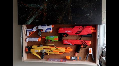 Like most 11 year olds, mine is nerf obsessed. DIY Secret Nerf Storage Wall//Do it yourself nerf wall ...