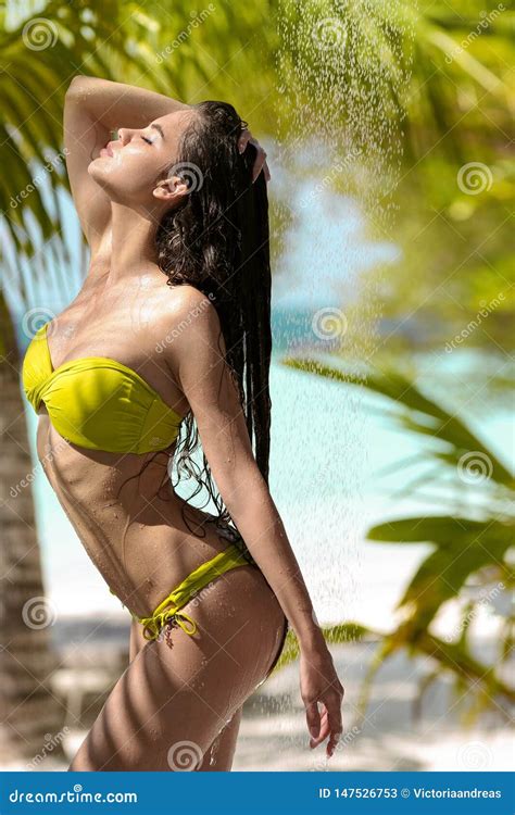 Carefree Wet Bikini Model Enjoying Outdoor Tropical Shower Beautiful