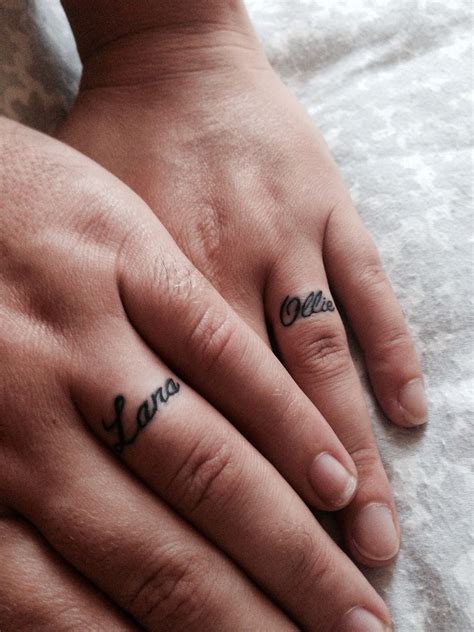Married couple tattooed wedding rings that imitate the real ones. Ring Finger Initial Tattoos For Couples - Best Tattoo Ideas