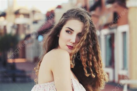 fashion portraite of a model with long curly healthy hair photo background and picture for free