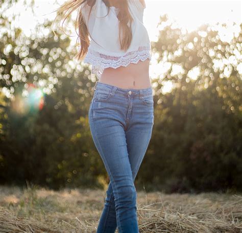 hd wallpaper woman wearing gray crop top and blue denim short shorts standing infront of body