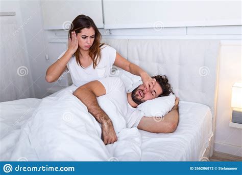 Couple In Bed Man Snoring And Woman Can`t Sleep Snoring Man And Young Woman Couple Sleeping