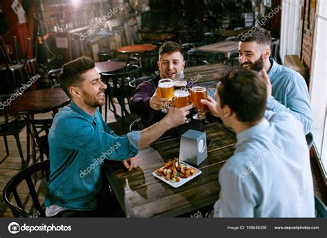 Men Drinking Beer Pub Friends Toasting Alcohol Drinks Bar High — Stock