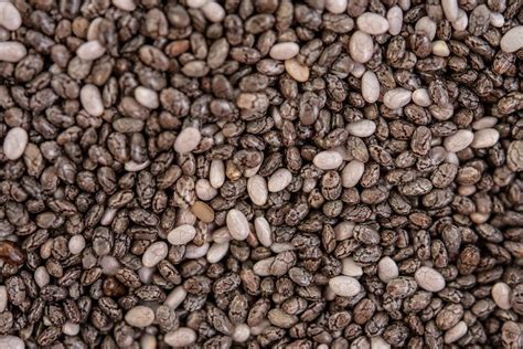 Chia seeds can be eaten cooked or raw, but they should be added to another food or soaked before eating. Macro image of Chia Seeds background image - Creative ...