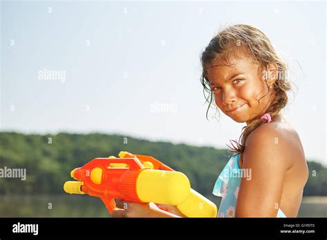 Babe Girl With Water Gun Hi Res Stock Photography And Images Alamy