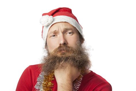 Unhappy Funny Santa Claus With Real Beard And Red Hat And Shirt Looking