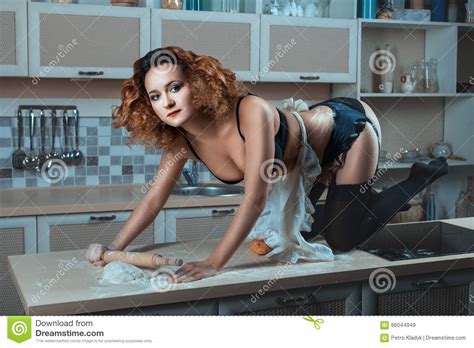 Girl In Underwear On The Kitchen Table Stock Image