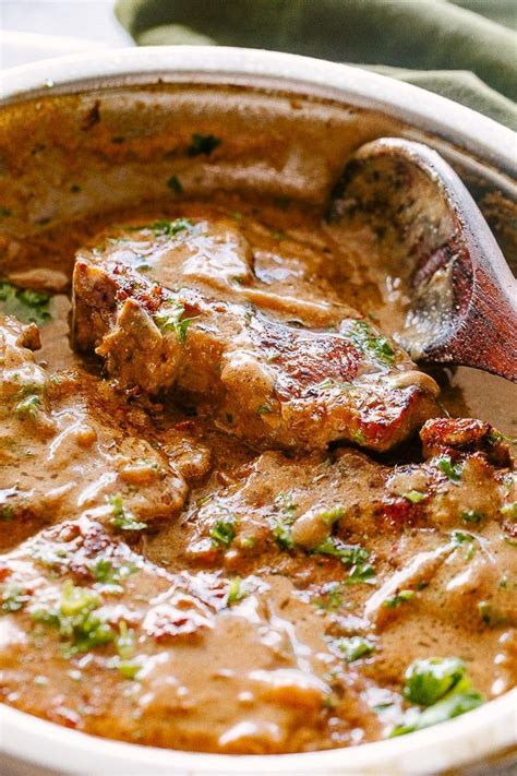 Savory pork + tangy balsamic + sweet tomatoes. Smothered Pork Chops - Juicy and delicious pan-seared pork ...