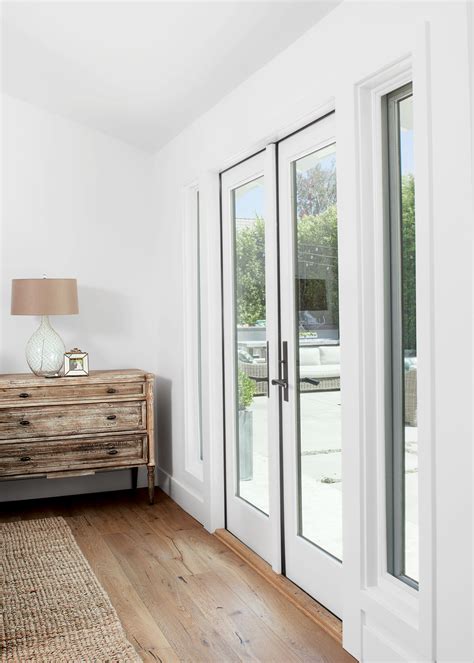 Use your voice to raise or lower shades. French doors leading to a wonderful backyard space ...