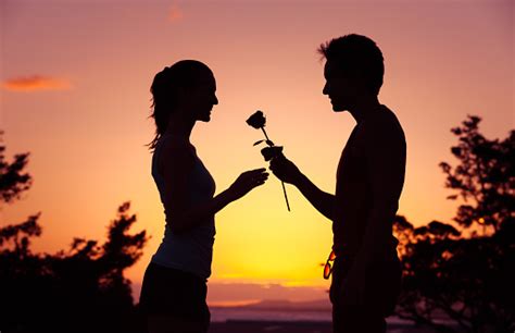 Man Giving Woman A Rose Stock Photo Download Image Now Istock