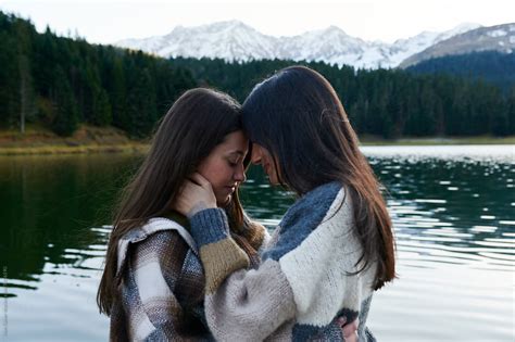 Young Lesbian Couple Sharing A Moment On A Dock By Ivan Gener Lesbian