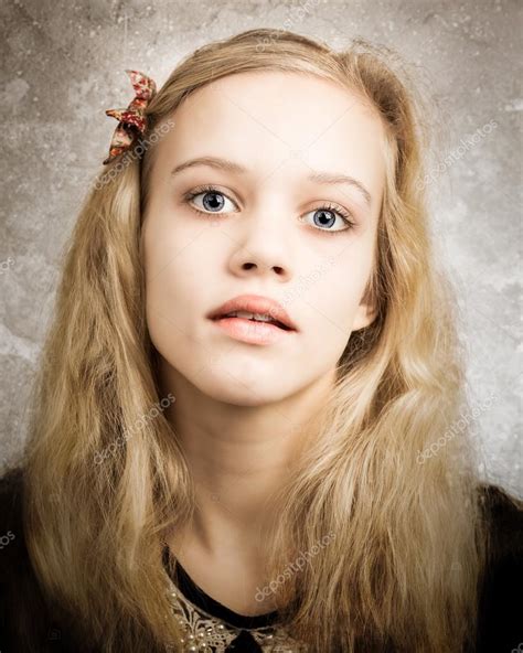 Beautiful Blond Teenage Girl Looking In The Camera Stock Photo By