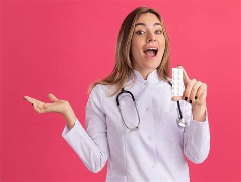 Free Photo Excited Young Female Doctor Wearing Medical Robe With