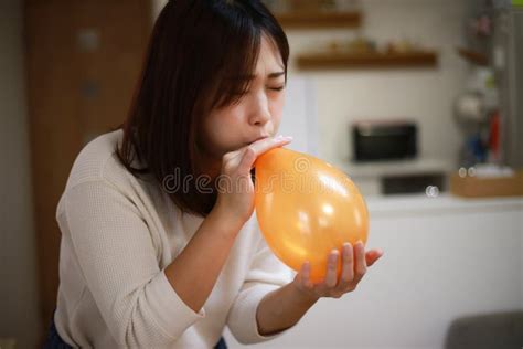 Woman Inflating A Balloon Stock Image Image Of Playing 244452865