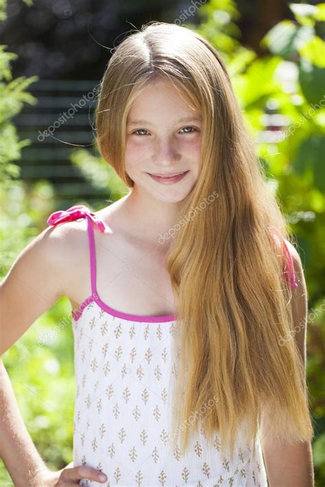 Portrait Of A Beautiful Young Blonde Little Girl Stock Photo By