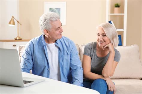 Mature Couple Using Video Chat On Laptop Stock Image Image Of