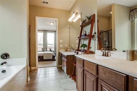 Tub and shower combos are available as prefabricated kits or can be installed as a custom design. Master bath with ceramic tile, dual vanity and separate ...