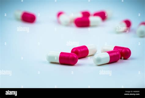 Pink White Capsule Pill On Blurred Capsule Background Antibiotic Drug