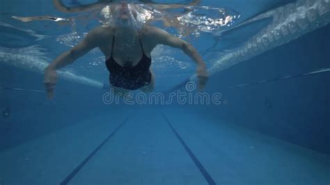 Woman Swimmer Swimming Breaststroke In Waterpool Underwater View Stock