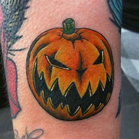 Illustrative Style Colored Arm Tattoo Of Evil Pumpkin Tattooimagesbiz