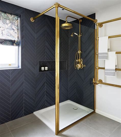 Dated mauve tile becomes classic herringbone. 11 Bathrooms with Black Herringbone Tiles