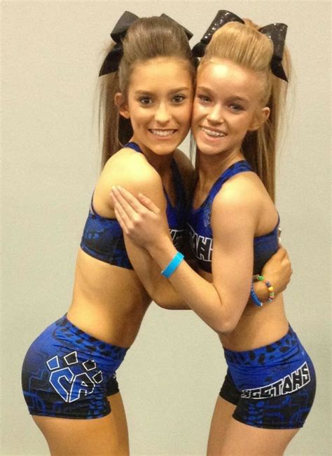 Cheer Athletics Cheetahs Cheerleaders Posting Embrace Hair Bows Uniforms Co Cheer Athletics