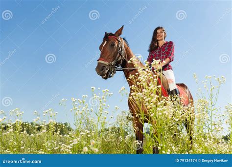 Young Woman Riding A Horse In Flowery Meadow Stock Photo Image Of