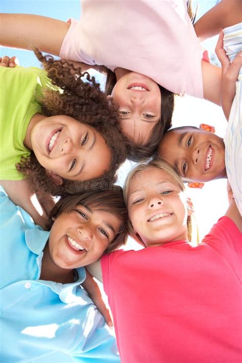 Group Of Children Looking Down Into Camera Stock Photo Image Of Five