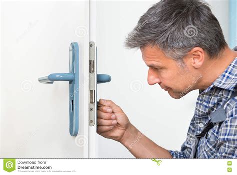 We did not find results for: Carpenter Fixing Lock In Door With Screwdriver Stock Photo - Image of repairman, house: 76660762