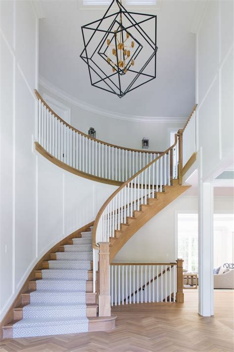 Gorgeous Entryway Staircase Curved Staircase While Millwork Walls