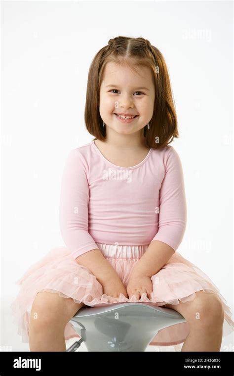 Little Girl Sitting On Chair Stock Photo Alamy