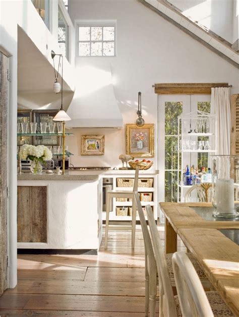 Authentic barn beams bring the country while conical drum pendant lights add an urban edge. Friday Favorites - The Charm of French Farmhouse Kitchens