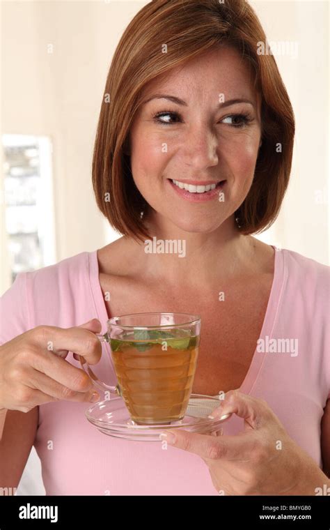 Woman Drinking Herbal Tea Stock Photo Alamy