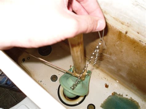 Unscrew the old handle remove the broken handle by unscrewing the plastic nut from the back of the handle, inside the toilet tank. How to Fix a Stuck Toilet Handle