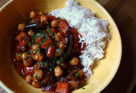 Add the water, bring to a boil, add the couscous and blend well. eggplant ragout with tomatoes peppers and chickpeas