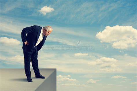 Your lockdown stock images are ready. Senior Man Standing Over The Precipice Stock Photo - Image ...