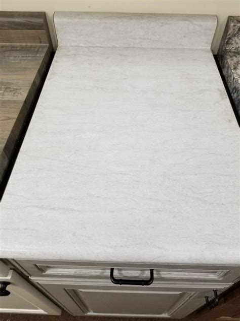 Popular and durable, the formica countertop is an inexpensive choice with a wide variety of colors, textures and shapes to choose from. Wilsonart white cascade | Wilsonart laminate countertops, Wilsonart countertops, Wilsonart