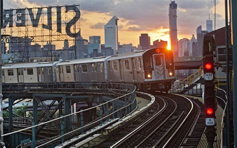 Subway Train Buildings Skyscrapers Sunset Hd Wallpaper Man Made