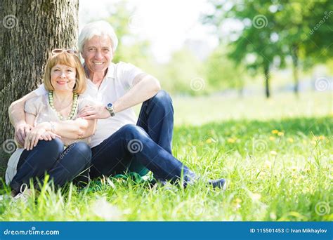 Senior Couple Sitting On Grass Stock Image Image Of Portrait Female