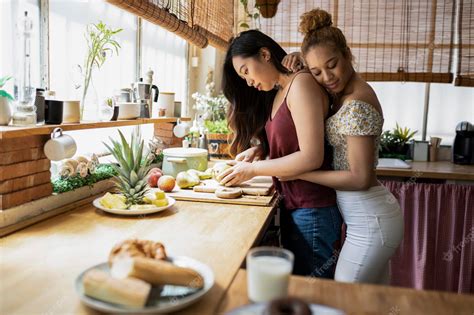 Premium Photo Biracial Lesbian Couple Preparing Food In The Kitchen