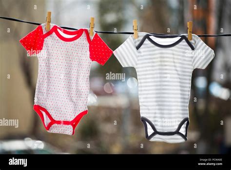 Baby Clothes Hanging On The Clothesline Stock Photo Alamy