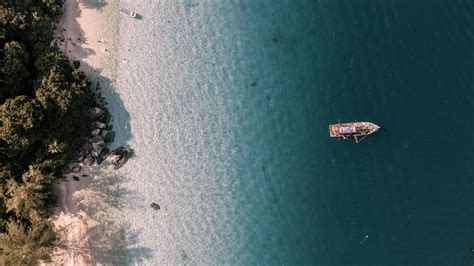 Aerial View Of Boat In Ocean Near A Beach 1231068 Stock Photo At Vecteezy