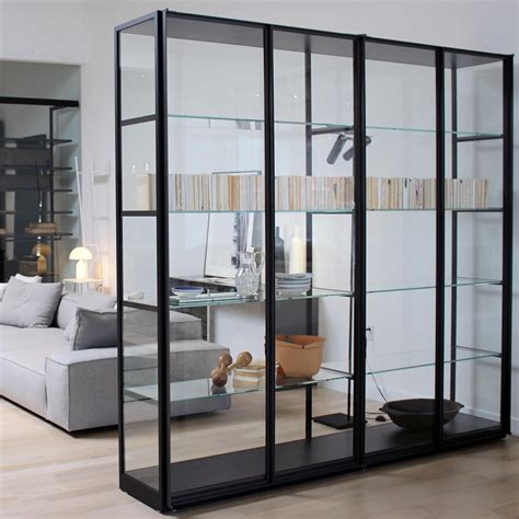 Install your own glass inserts today. The Ex-Libris Cabinet by #PieroLissoni for #Porro features tempered glass doors and sides with ...