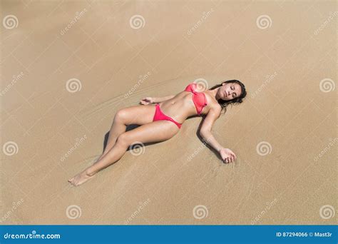 Attractive Young Caucasian Woman In Swimsuit Lying On Beach Top View Girl Wet Sand Sea Ocean