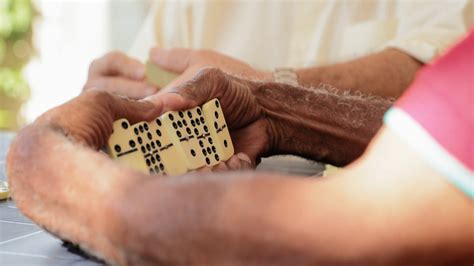 Senior Latino Man Playing Domino With Old Friends Stock Video Footage