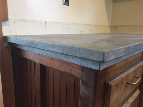 3cm material can go directly on top of the cabinets without the need for plywood support. 3cm eased edge detail w/ set-back soapstone trim (With ...