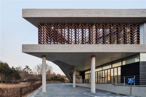 Moveable Wooden Screens Are Set Into Concrete Facades Of Mokyeonri Wood