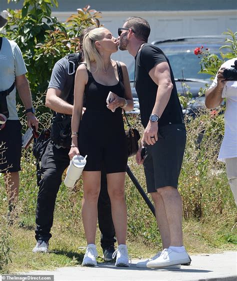 Tarek El Moussa And Wife Heather Rae El Moussa Kiss As They Check Out A